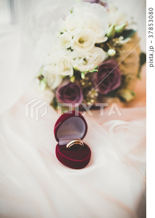 Two golden wedding rings isolated background 37853080