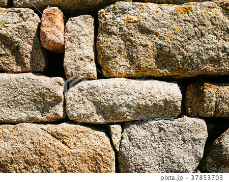 stone wall from pink granite boulders in Brehat 37853703