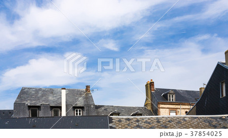 blue sky with white clouds over houses in Etretat blue sky with white clouds over houses in Etretat 37854025