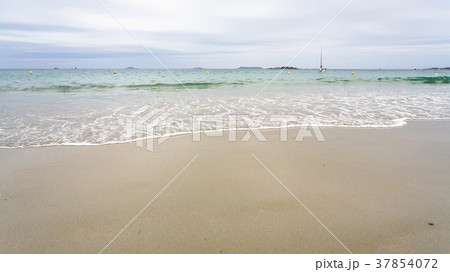 view of sea from sand beach in Perros-Guirec town 37854072