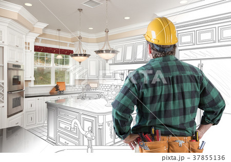 Male Contractor with Hard Hat and Tool Belt Looking At Custom Ki 37855136