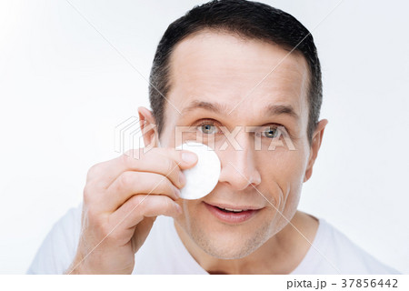 Portrait of a nice handsome man holding a cotton 37856442