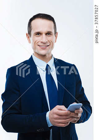 Smart intelligent businessman holding his 37857027
