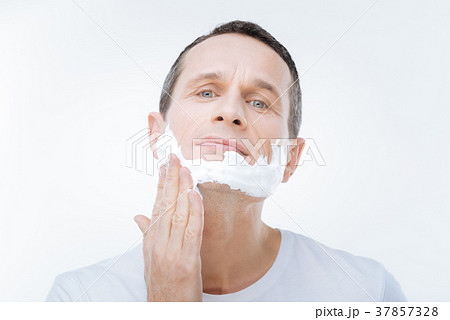 Handsome brutal man applying shaving foam 37857328