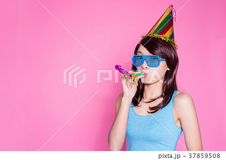 woman take noisemaker woman take noisemaker 37859508