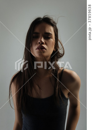 Nice earnest young woman staring 37859638