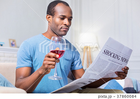 Pleasant nice man drinking alcohol Pleasant nice man drinking alcohol 37860084