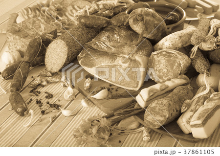 Variety of meats and sausages on table Variety of meats and sausages on table 37861105