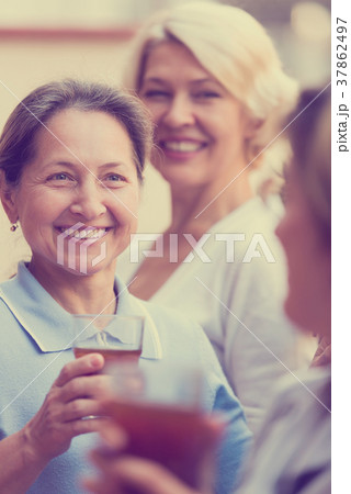 mature woman on a balcony 37862497