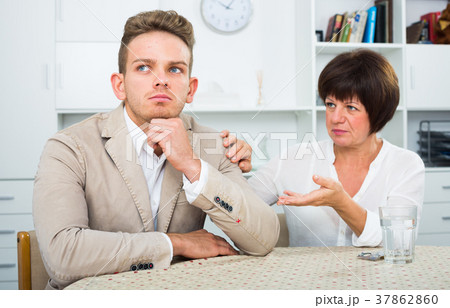 Mother calms the son Mother calms the son 37862860