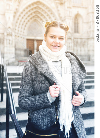 Cheerful young girl in scarf at the street 37863368