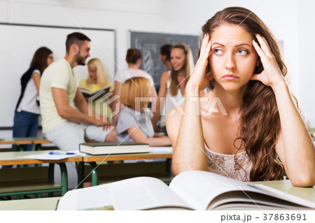 Lonely sad student in the classroom Lonely sad student in the classroom 37863691