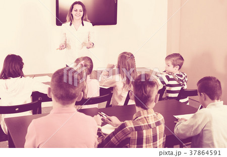 children with teacher in classroom children with teacher in classroom 37864591