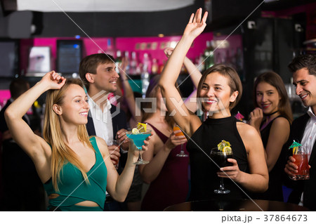 Ordinary colleagues dancing on corporate party 37864673