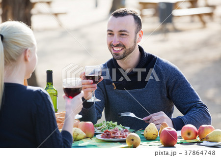 Couple having picnic at countryside 37864748
