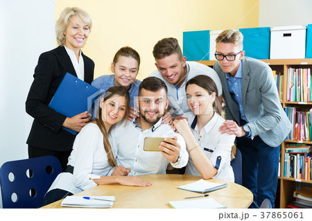 students and female professor taking selfie students and female professor taking selfie 37865061
