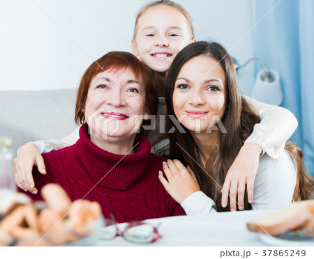 Smiling grandmother with daughter and granddaughter 37865249