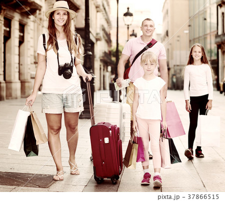 Big family of tourists strolling Big family of tourists strolling 37866515