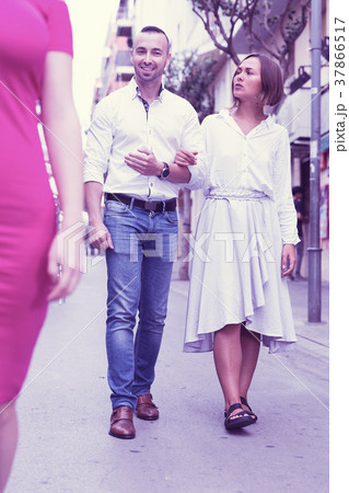 Angry female is jealousying because her boyfriend is staring on 37866517