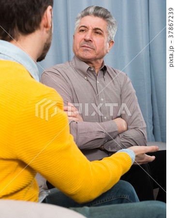 Adult father and son solve problems 37867239