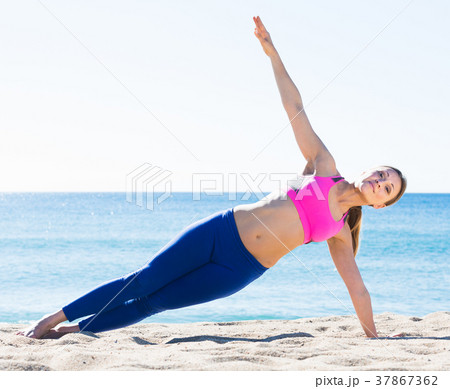 Positive healthy woman stretching body 37867362