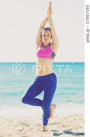 Adult female is practicing asana Adult female is practicing asana 37867365