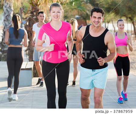 People running along embankment People running along embankment 37867959