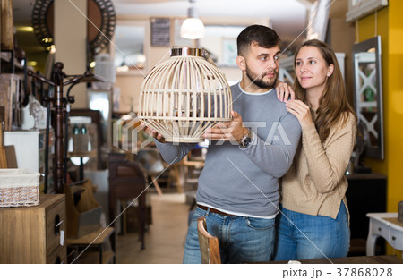 Couple looking for stylish hanging lamp Couple looking for stylish hanging lamp 37868028