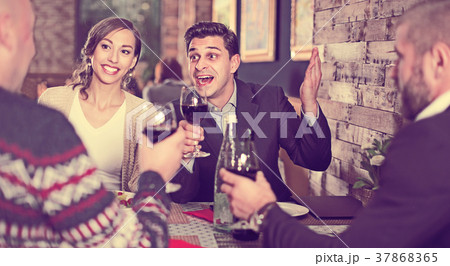Company celebrating in restaurant Company celebrating in restaurant 37868365