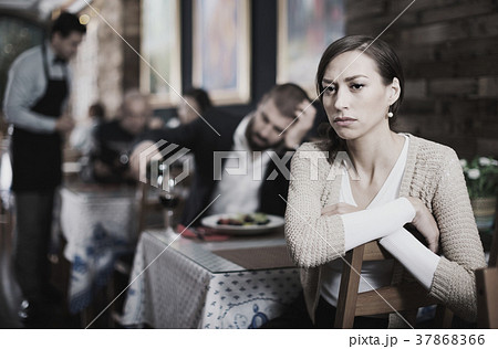Portrait of upset man and woman in the restaurant on meeting Portrait of upset man and woman in the restaurant on meeting 37868366