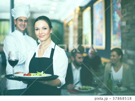 Waitress with chef in restaurant 37868518