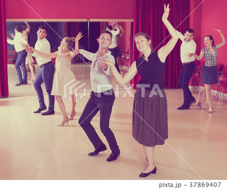 Dancing couples enjoying latin dances Dancing couples enjoying latin dances 37869407