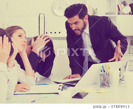 Businessman feeling angry to coworkers in office 37869411