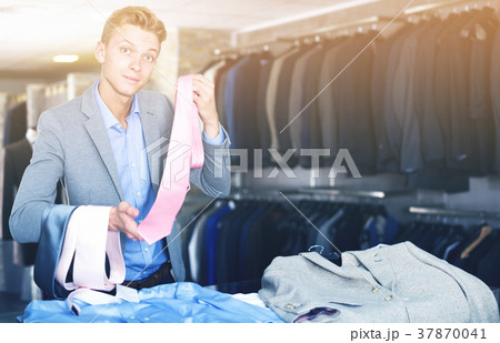Man buyer choosing colored tie 37870041