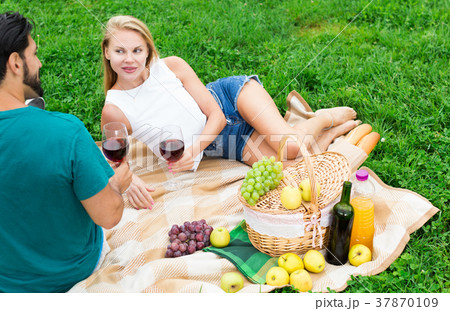 Couple are talking lying and drinking wine Couple are talking lying and drinking wine 37870109