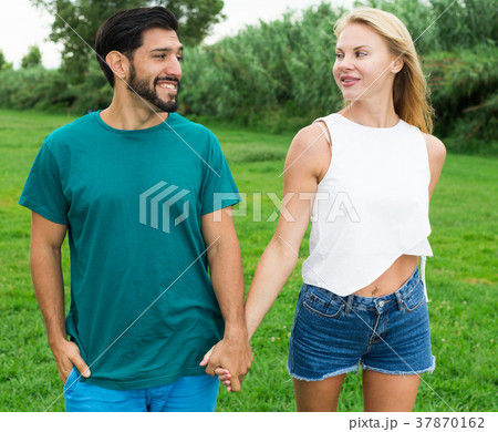 Couple is talking in time walking on nature 37870162