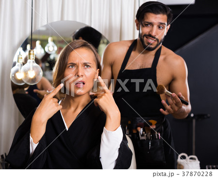 professional makeup artist with female shocked professional makeup artist with female shocked 37870228