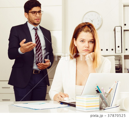 Frustrated business woman with angry chief 37870525