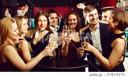 Cheerful working team are resting and drinking cocktails 37870575