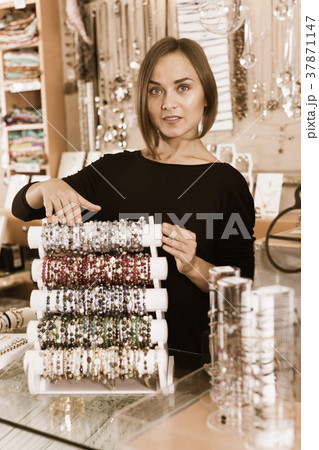 portrait of woman worker selling bracelets portrait of woman worker selling bracelets 37871147