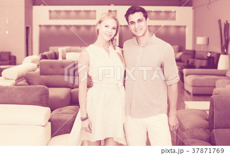 Couple are satisfied by buying new sofa Couple are satisfied by buying new sofa 37871769