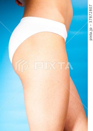 Close up photo of woman's belly and white panties 37872807