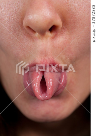 Woman showing the folded tongue 37872838