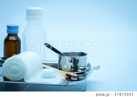 Wound care dressing set on stainless steel plate.  Wound care dressing set on stainless steel plate.  37875935