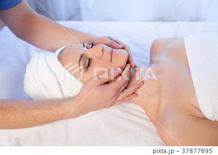 doctor cosmetologist doing facial massage girl spa 37877695