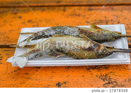 Grilled trout fish on wooden table 37878308