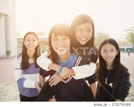 Group Of Teenage Students playing in school 37879388
