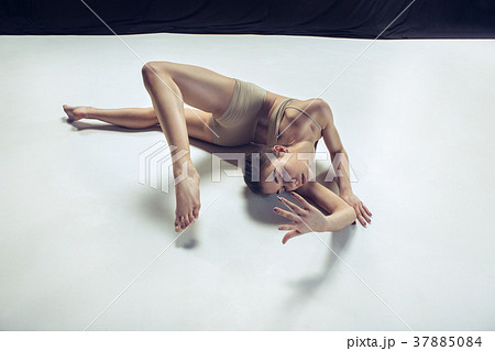 Young teen dancer ion white floor background. Young teen dancer ion white floor background. 37885084