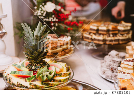 fruits, cakes and other sweets on the wedding  37885105