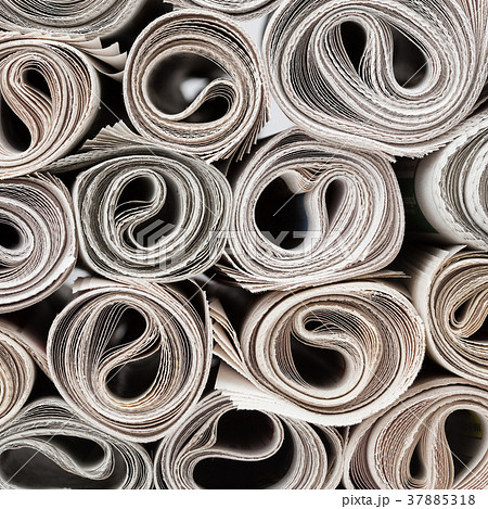 Rolls of newspapers. 37885318